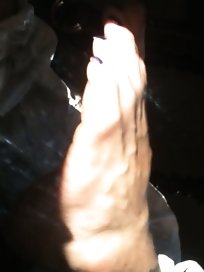 Used red toenails, and soles feet after day at beach